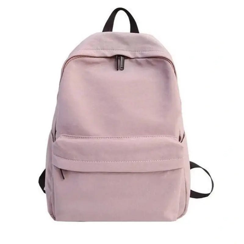 Sac à dos fille décontracté rose clair avec bretelles noires et fermetures éclair argentées
