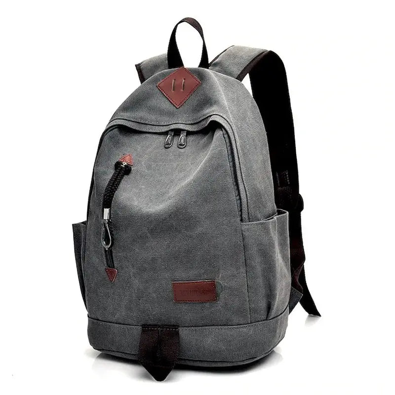 Sac à dos gris en toile avec accents en cuir marron et poche zippée frontale pour garçon CE1