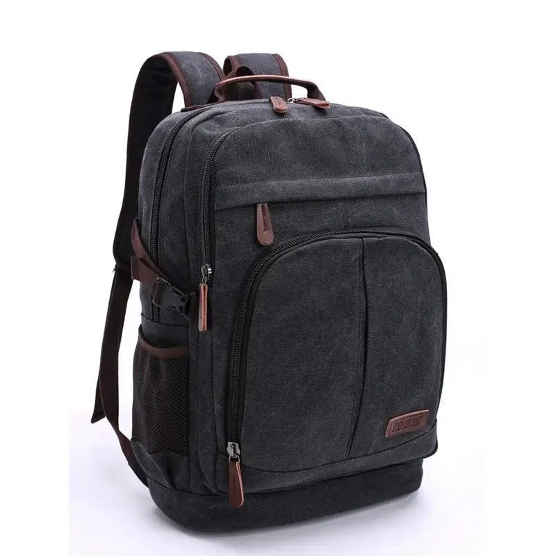 Sac à dos en toile gris foncé avec accents en cuir marron et plusieurs compartiments