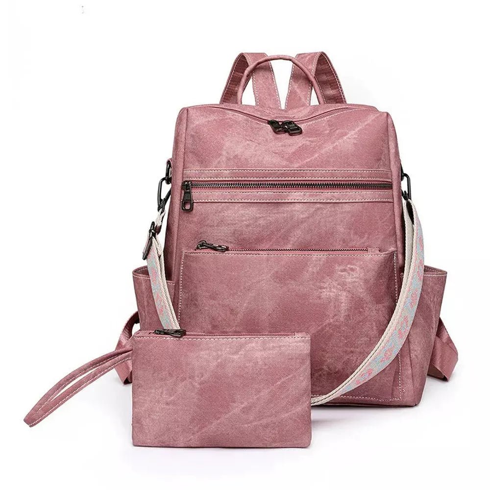Sac à dos en cuir vintage rose avec plusieurs zips et porte-monnaie assorti