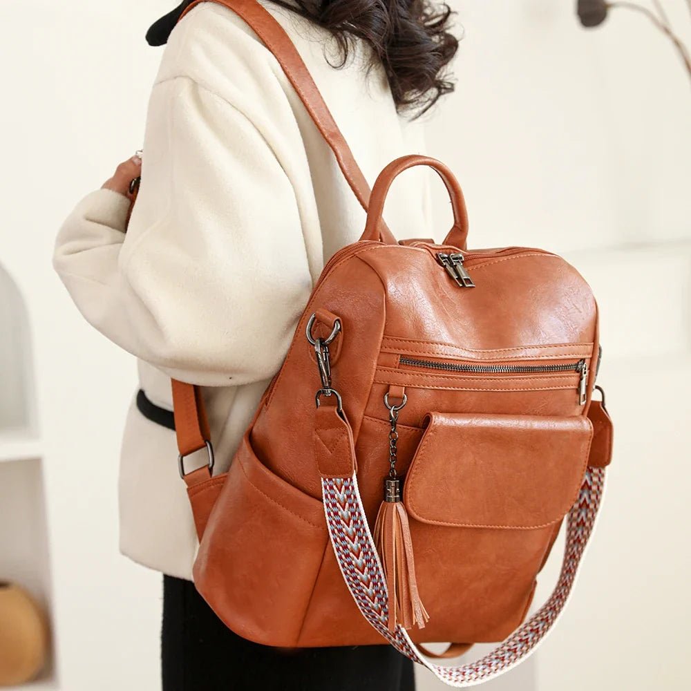 Sac à dos en similicuir pour femme avec bandoulière colorée et charm en tassel