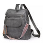 Sac à dos en similicuir gris pour femme avec poches multiples et bandoulière décorative