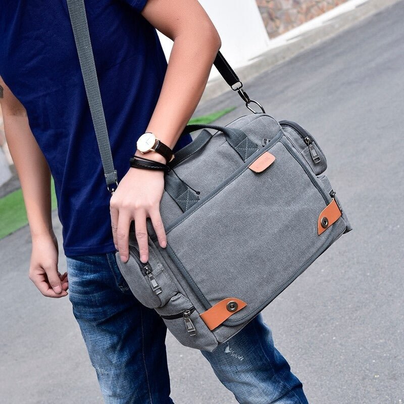 Sac à dos de voyage en toile grise avec accents en cuir marron