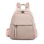 Sac à dos en cuir rose pâle avec poignée supérieure et deux bretelles ajustables