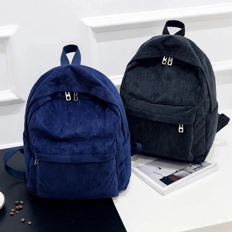Sac à dos fille en velours côtelé navy et noir avec poignée, zippers et poche avant