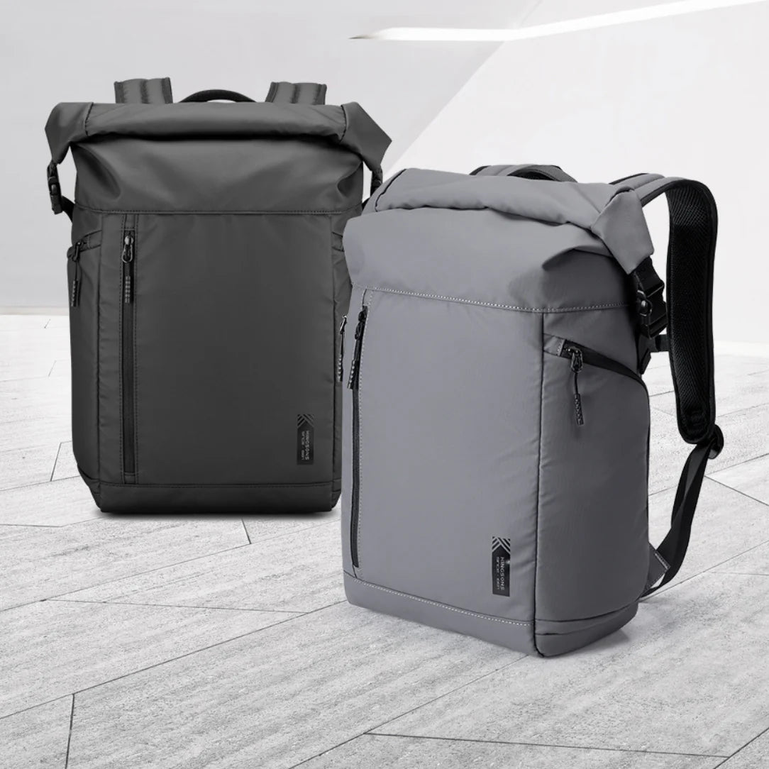 Sac à dos à rouleau Nebula XB gris foncé et gris moyen avec poches zippées et bretelles