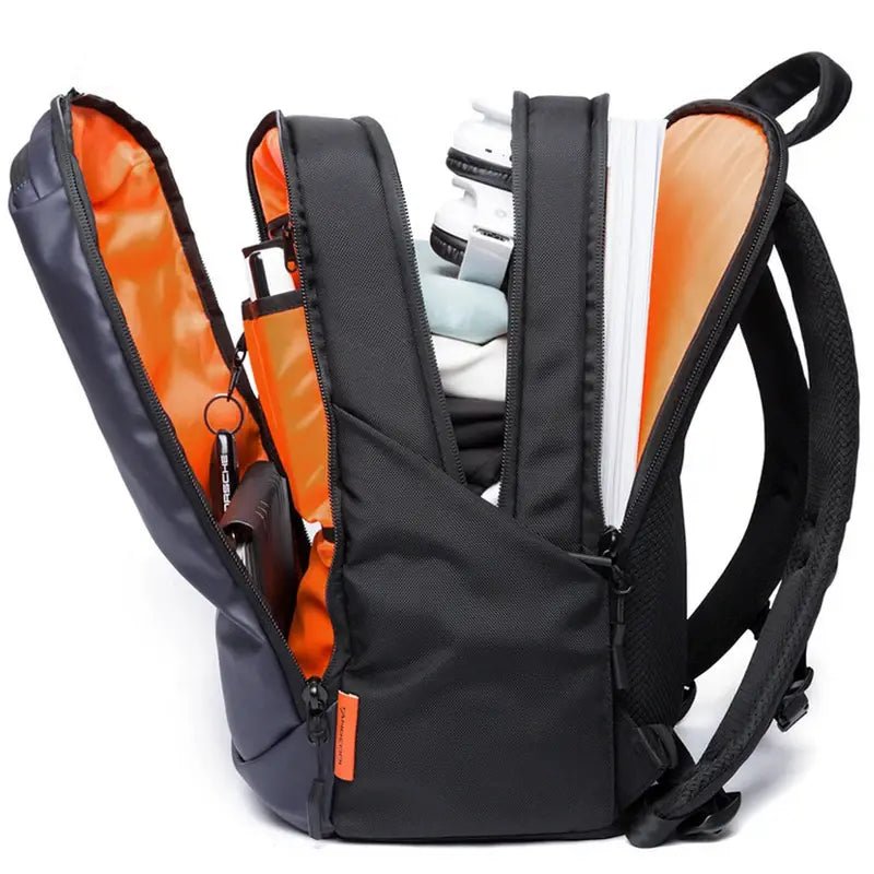 Sac à dos 3 compartiments ouvert noir et navy avec doublure orange et plusieurs poches