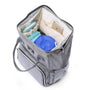 Sac à dos bébé à langer gris avec compartiments, essentiels bébé et smartphone