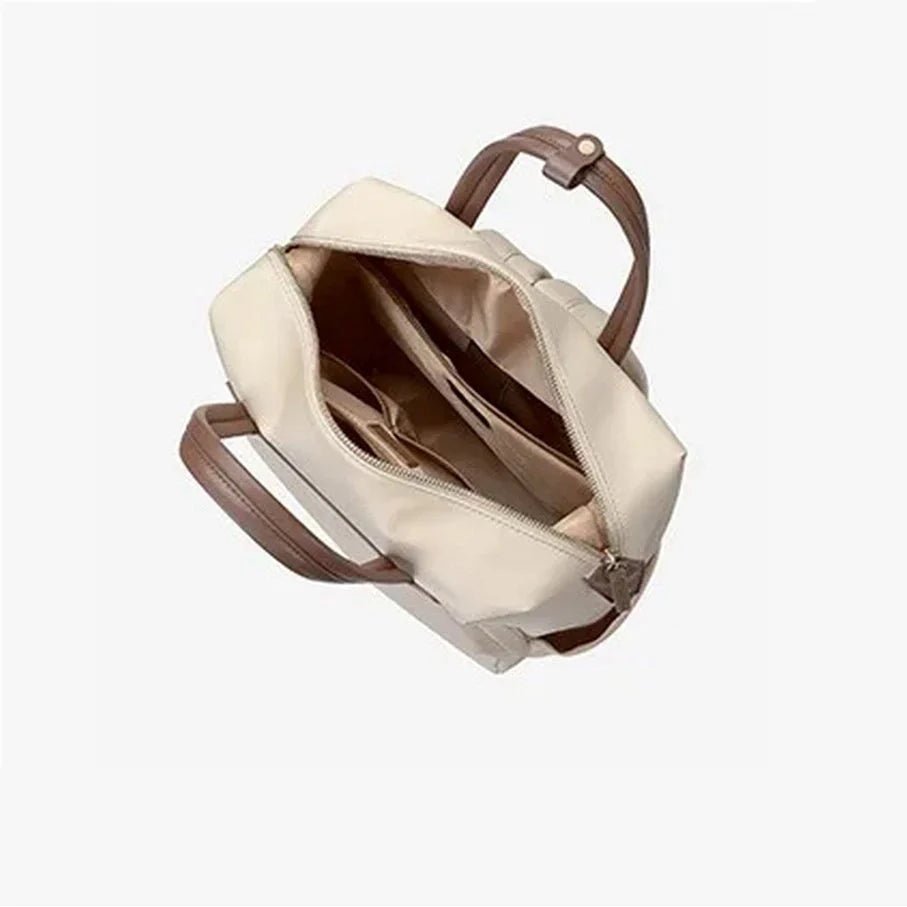 Sac à dos beige femme avec poignées marron et multiples compartiments intérieurs