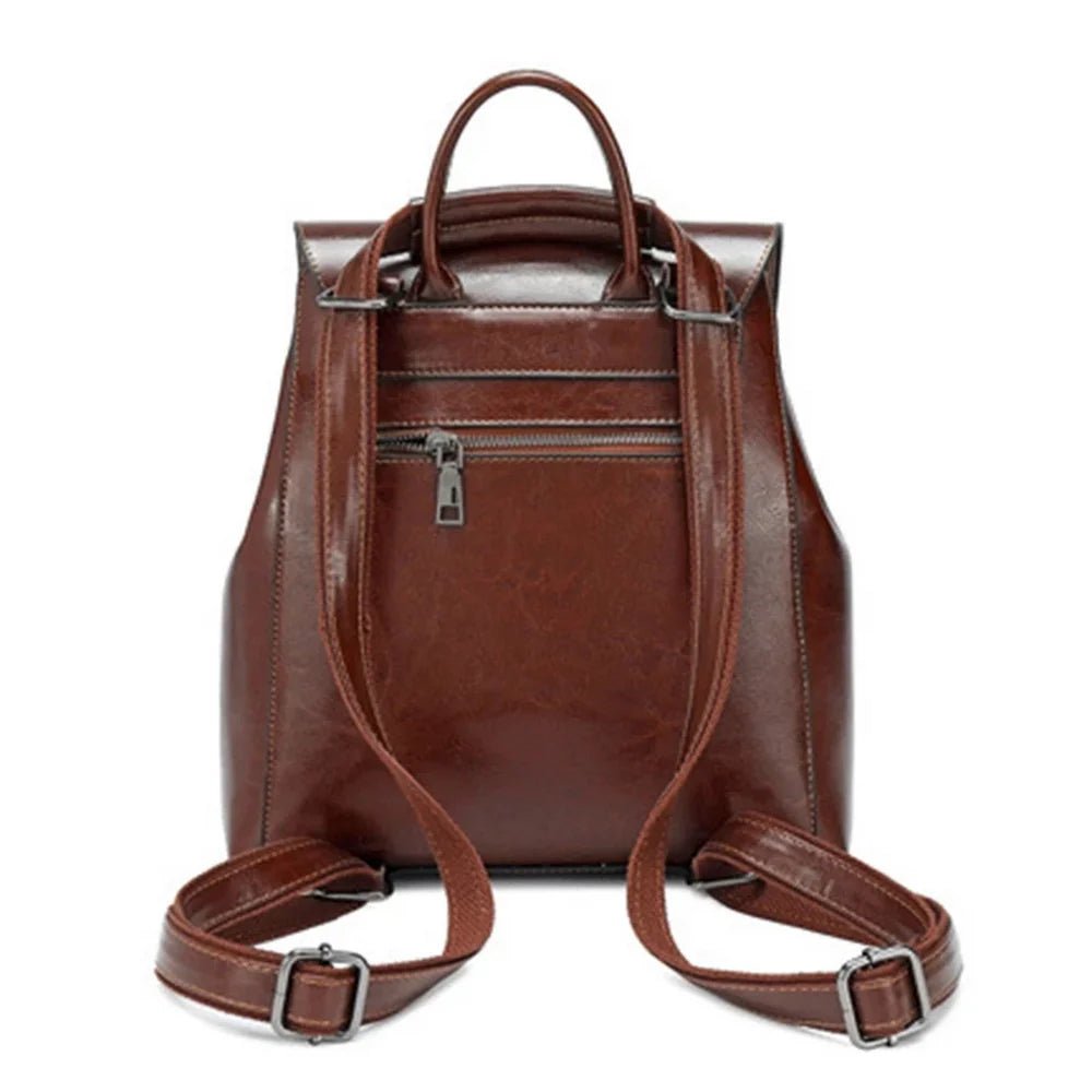Sac à dos cuir marron brillant avec bretelles ajustables et plusieurs poches zippées