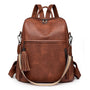 Sac à dos en cuir souple marron avec poche avant, zips latéraux, bretelles ajustables et tassel