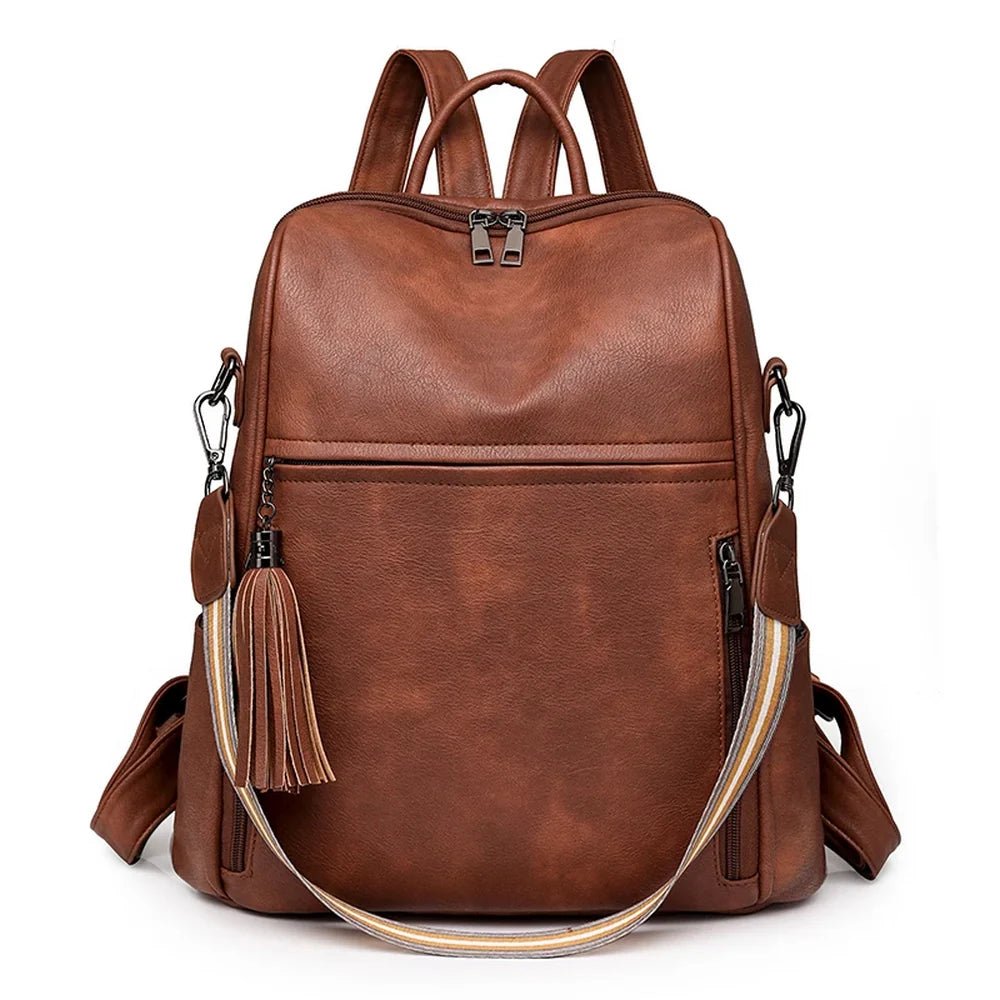 Sac à dos en cuir souple marron avec poche avant, zips latéraux, bretelles ajustables et tassel