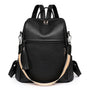 Sac à dos en cuir souple noir avec bandoulière rayée multicolore et charm à pompon