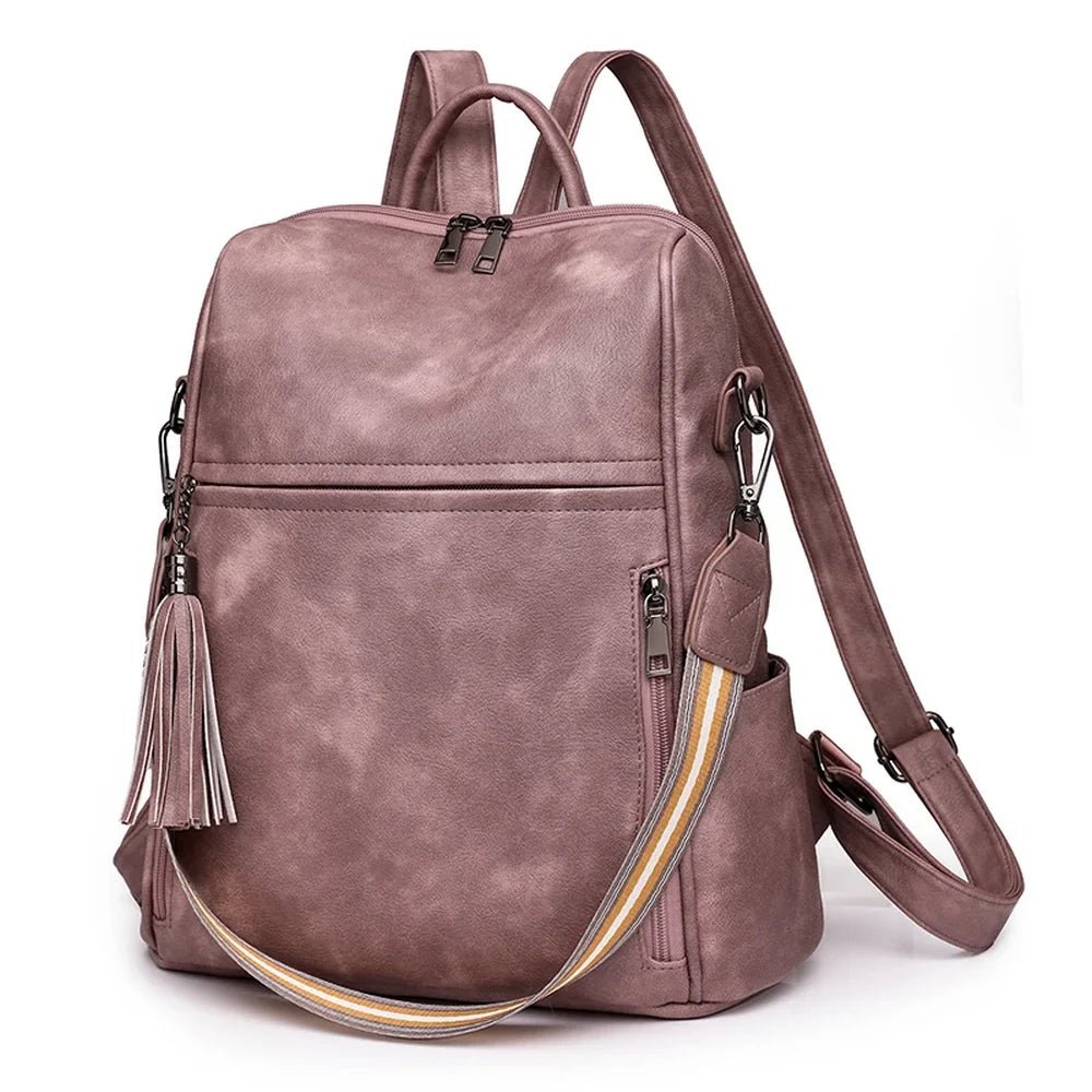 Sac à dos cuir souple en rose poussière convertible en sac à main avec plusieurs compartiments