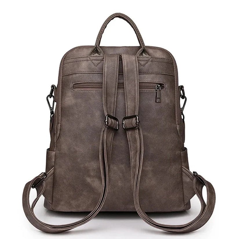 Sac à dos cuir souple en faux cuir gris foncé avec bretelles ajustables et poignée supérieure