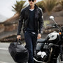 Sac à dos de sport noir en cuir avec poignée, zip et compartiment chaussures