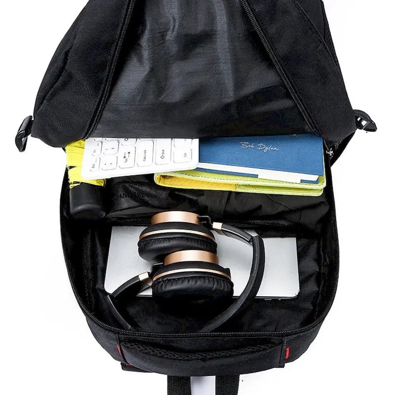 Sac à dos de sport Deren noir ouvert avec ordinateur portable, écouteurs et livres