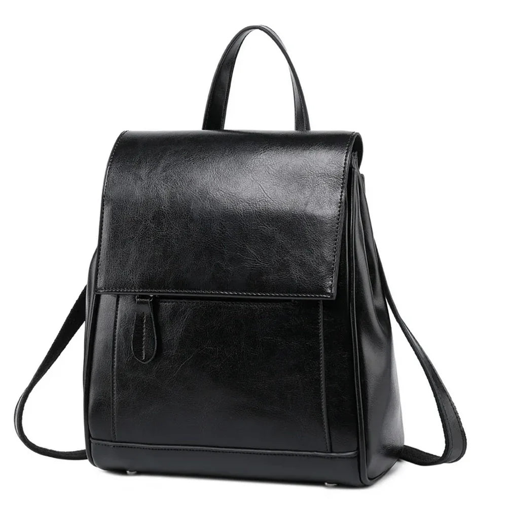 Sac à dos en cuir de vachette noir avec rabat, bandoulière ajustable et poche zippée