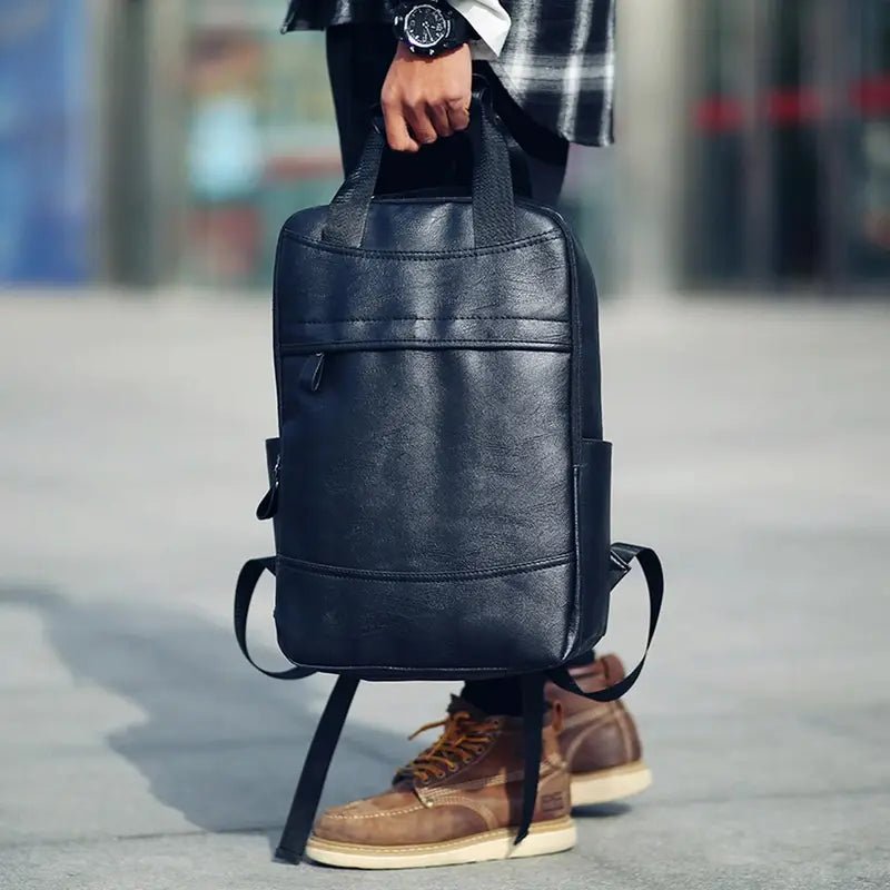 Sac à dos en cuir noir pour homme avec poignée supérieure et poche zippée frontale