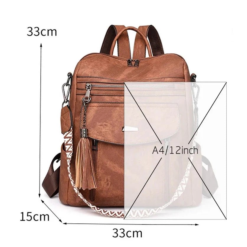 Sac à dos en cuir végétal marron avec breloque à tassel et sangle à motif