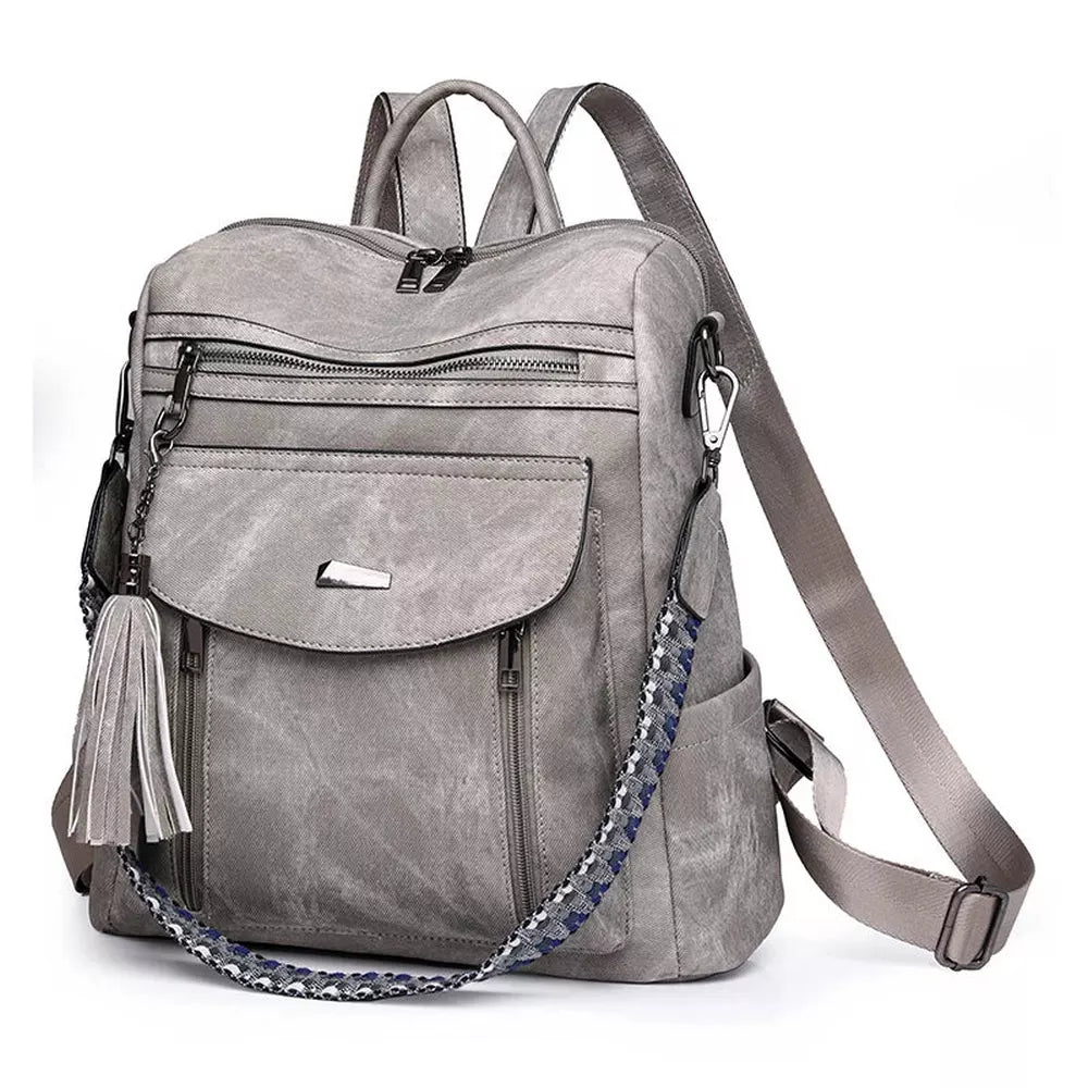Sac à dos en cuir végétal gris avec plusieurs poches zippées et bandoulière tressée
