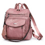 Sac à dos en cuir végétal rose avec plusieurs compartiments, tassel décoratif et bretelles ajustables