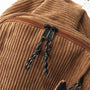 Tissu en velours marron avec zippers noirs et cordons de fermeture pour Sac à dos en velours