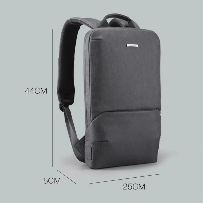 Sac à dos extra plat pour ordinateur en gris foncé avec poche frontale et port USB