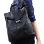 Sac à dos femme élégant en cuir patchwork noir avec poignée et fermeture à rabat
