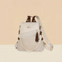Sac à dos en cuir blanc avec accents marron et détail pompon Graine d’Or