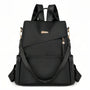 Sac à dos noir en nylon avec fermetures dorées et sangles ajustables