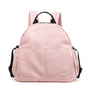 Sac à dos à langer en cuir rose avec bretelles noires et poches multiples