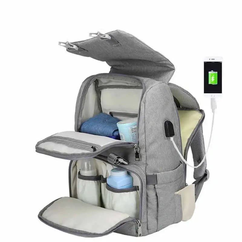 Sac à dos à langer ergonomique gris à plusieurs compartiments avec port de chargement USB externe