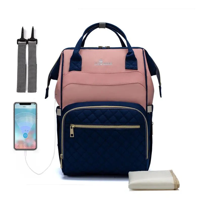 Sac à dos à langer le Queen rose et bleu marine avec poche quiltée et accessoires
