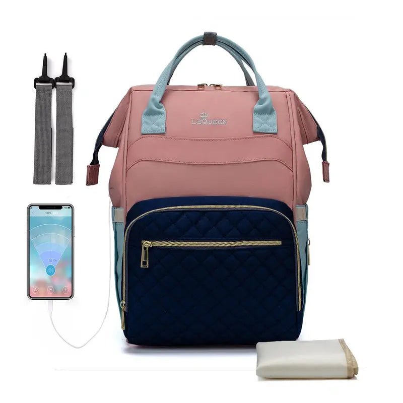 Sac à dos à langer le Queen rose et marine avec ports USB et accessoires pour bébé