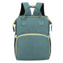 Sac à dos à langer lit en turquoise avec accents beige et zips dorés