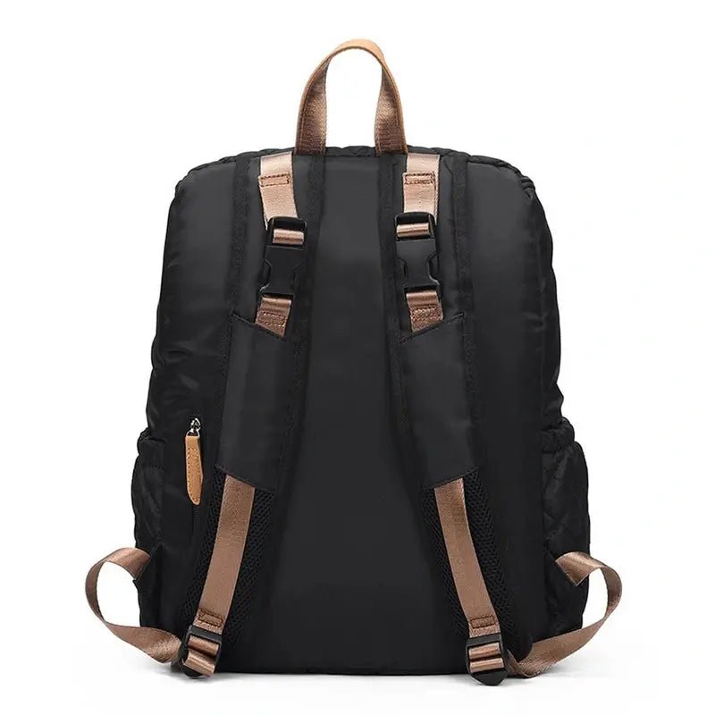 Sac à dos à langer noir en nylon avec bretelles et boucles en brun