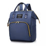 Sac à dos à langer tendance bleu marine avec poignées supérieures et zips dorés