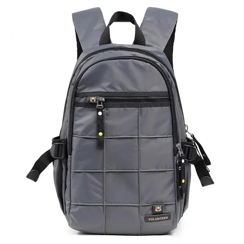 Sac à dos multi rangement gris en nylon matelassé avec plusieurs compartiments zippés