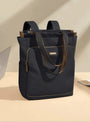 Sac à dos multifonction femme noir convertible avec bretelles marron et accents dorés