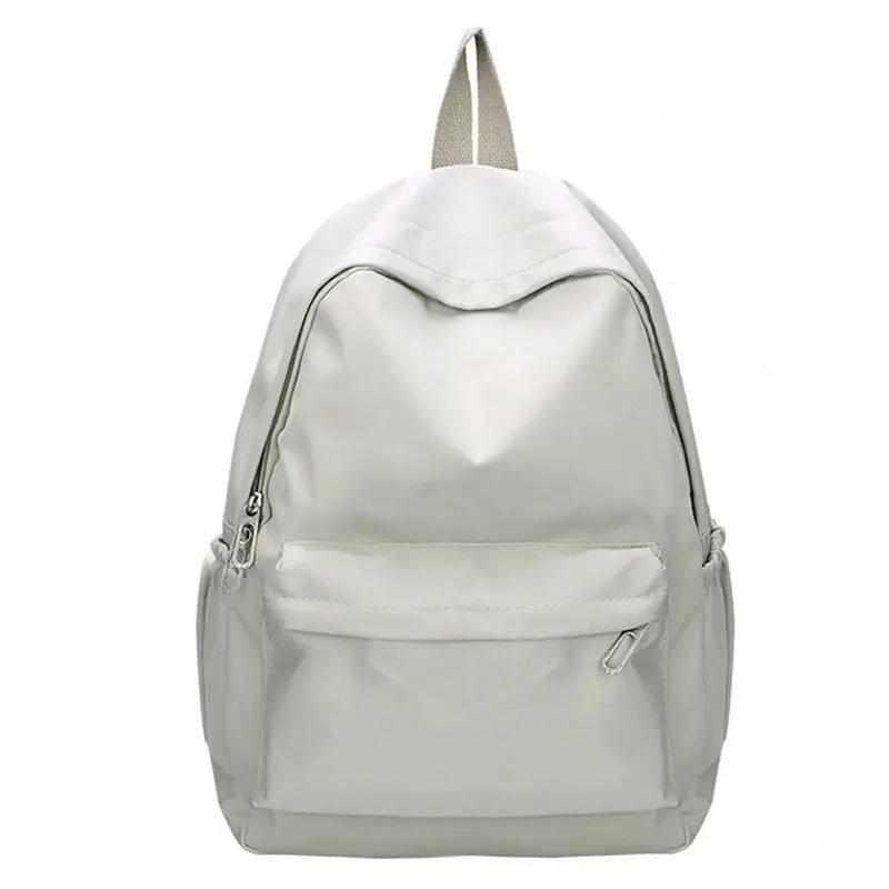 Sac à dos petite fille en tissu gris clair avec poche zippée et poches latérales