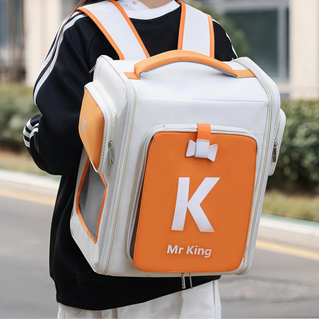 Sac à dos pour chat portable ventilé blanc et orange avec ventilation latérale