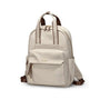 Sac à dos pratique pour femme en beige clair avec bretelles marron et fermetures dorées