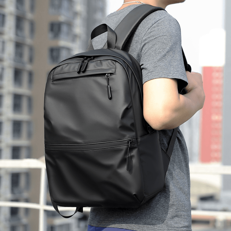 Sac à dos scolaire casual noir imperméable et résistant avec plusieurs compartiments zippés