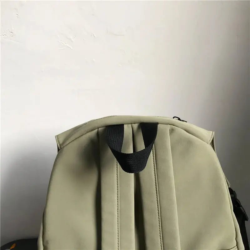 Sac à dos scolaire vert olive clair avec poignée supérieure noire