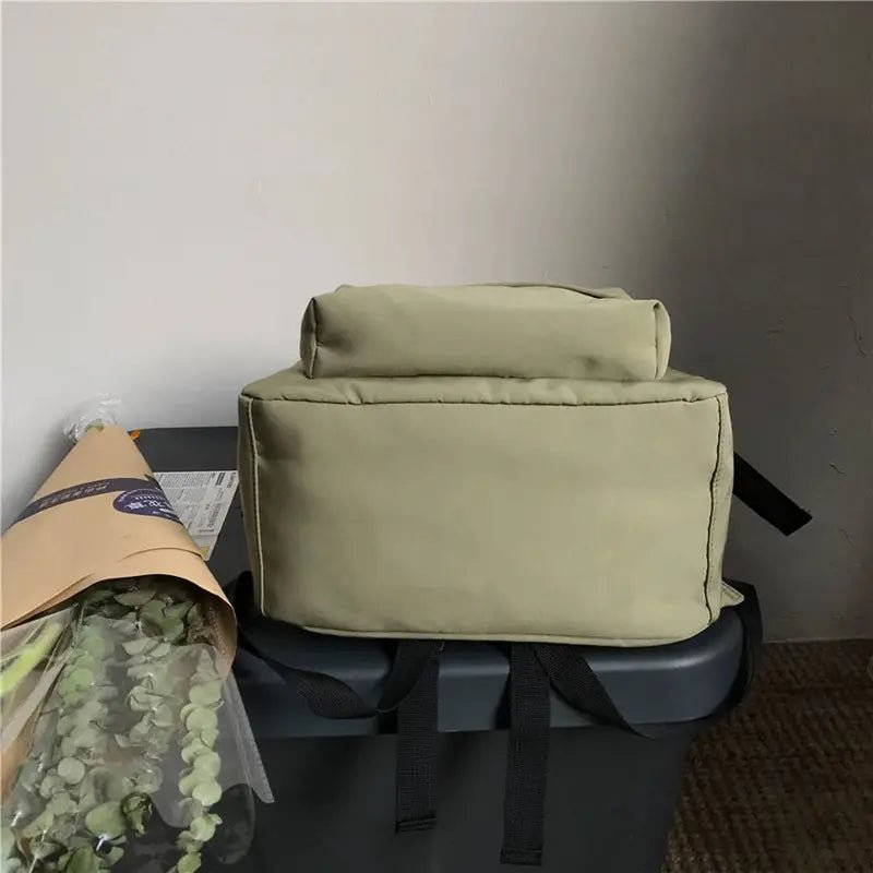 Sac à dos scolaire vert clair avec glacière souple rectangulaire, poignée et bandoulière