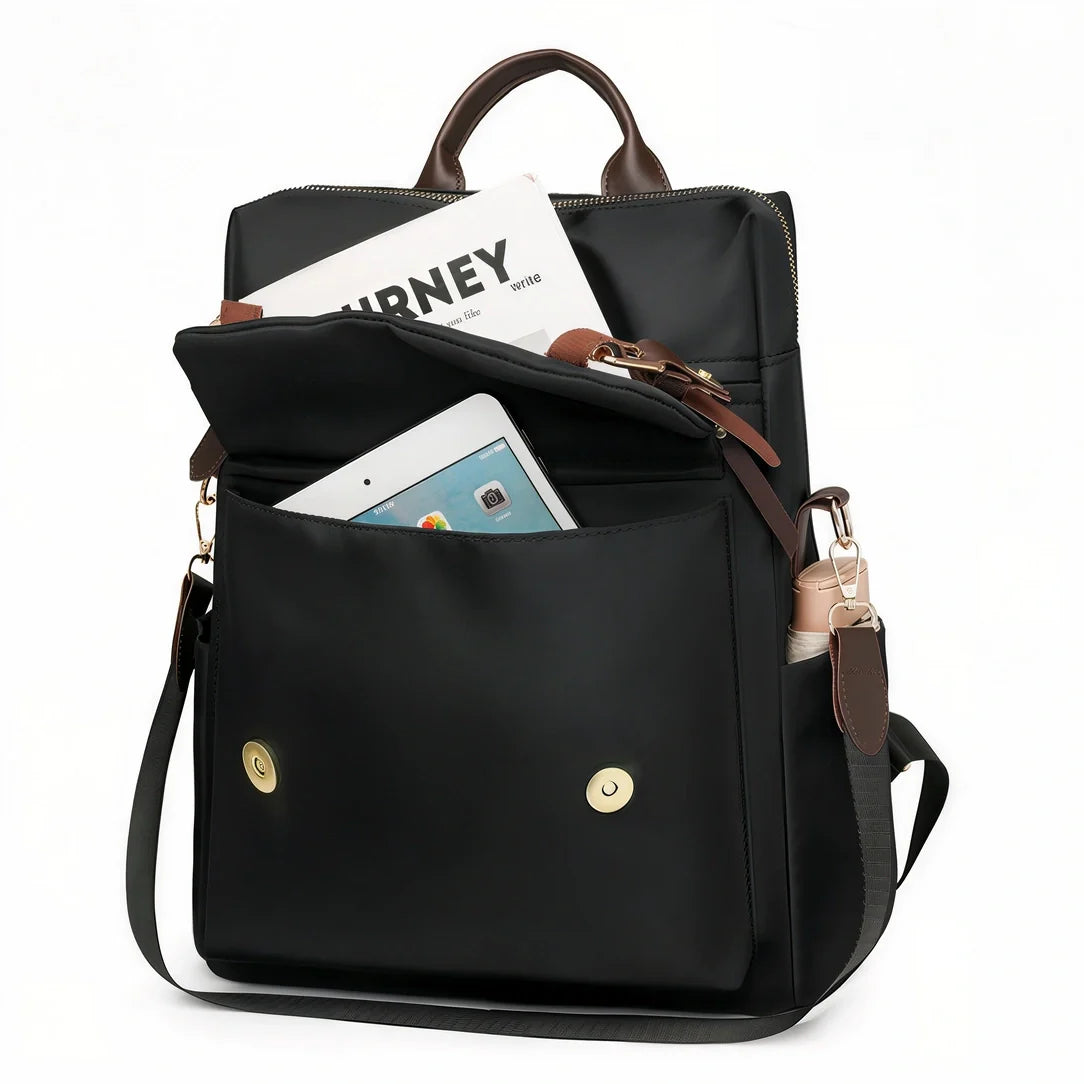 Sac à dos Sirocco en nylon noir avec accents cuir marron et quincaillerie dorée