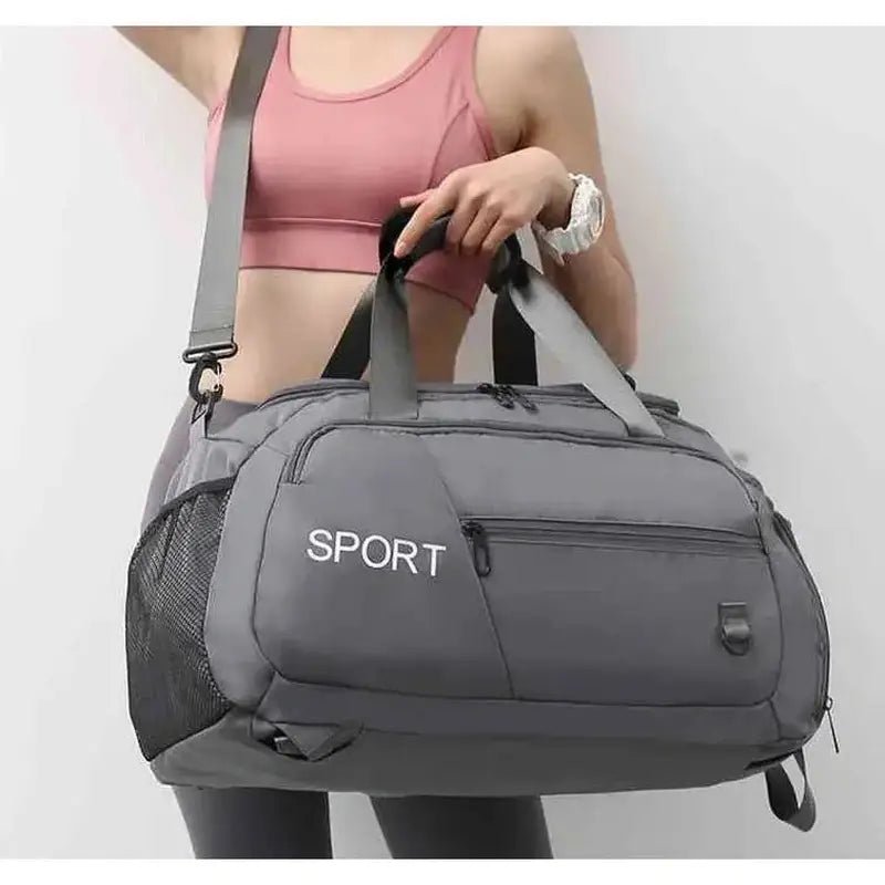 Sac à dos sport femme gris avec bandoulière et poignées supérieures