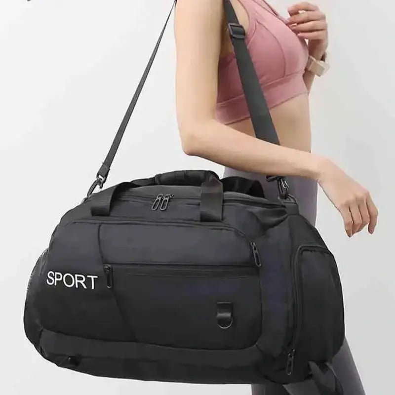 Sac à dos sport femme en noir avec plusieurs compartiments et bandoulière détachable