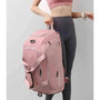 Sac à dos sport femme rose avec plusieurs compartiments et sangles pour le sport